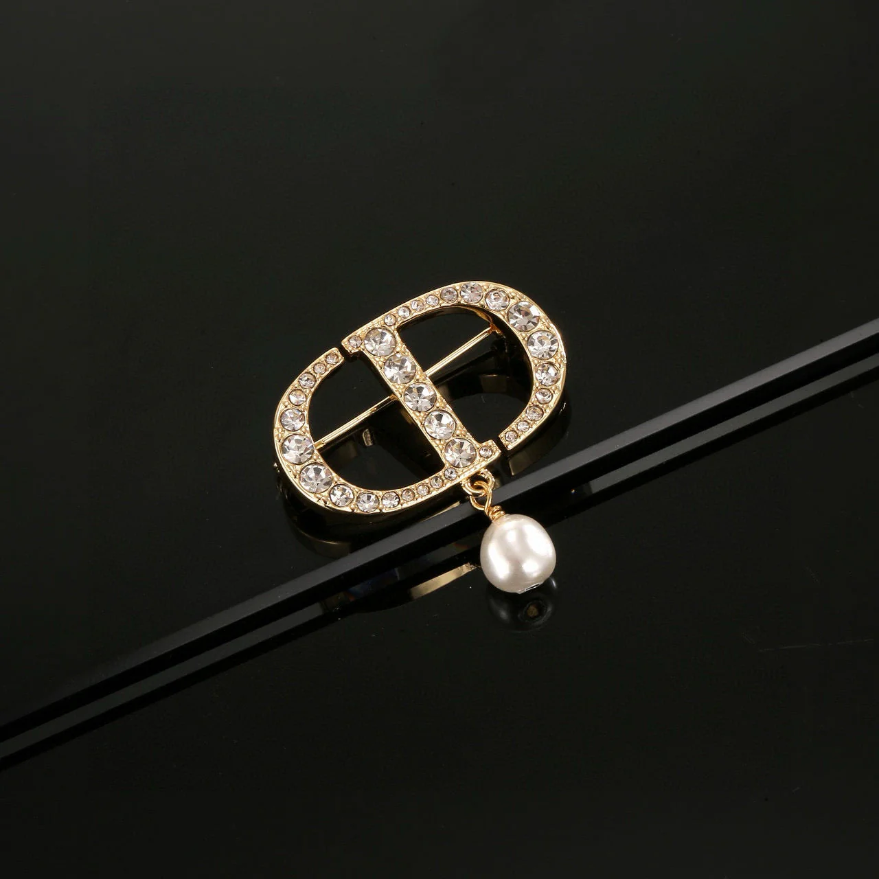 CD New Alphabet brooch