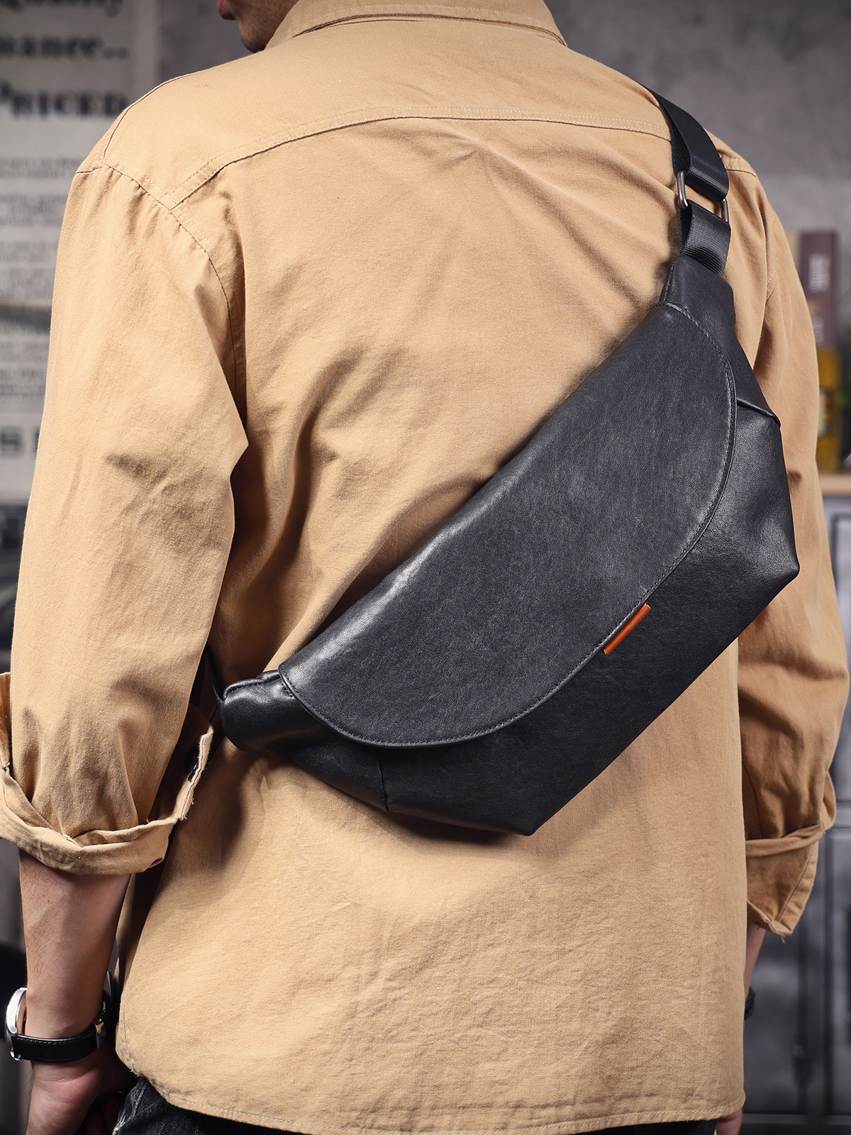 Sleek Black Leather Sling Bag - Minimalist Utility for the Modern Explorer