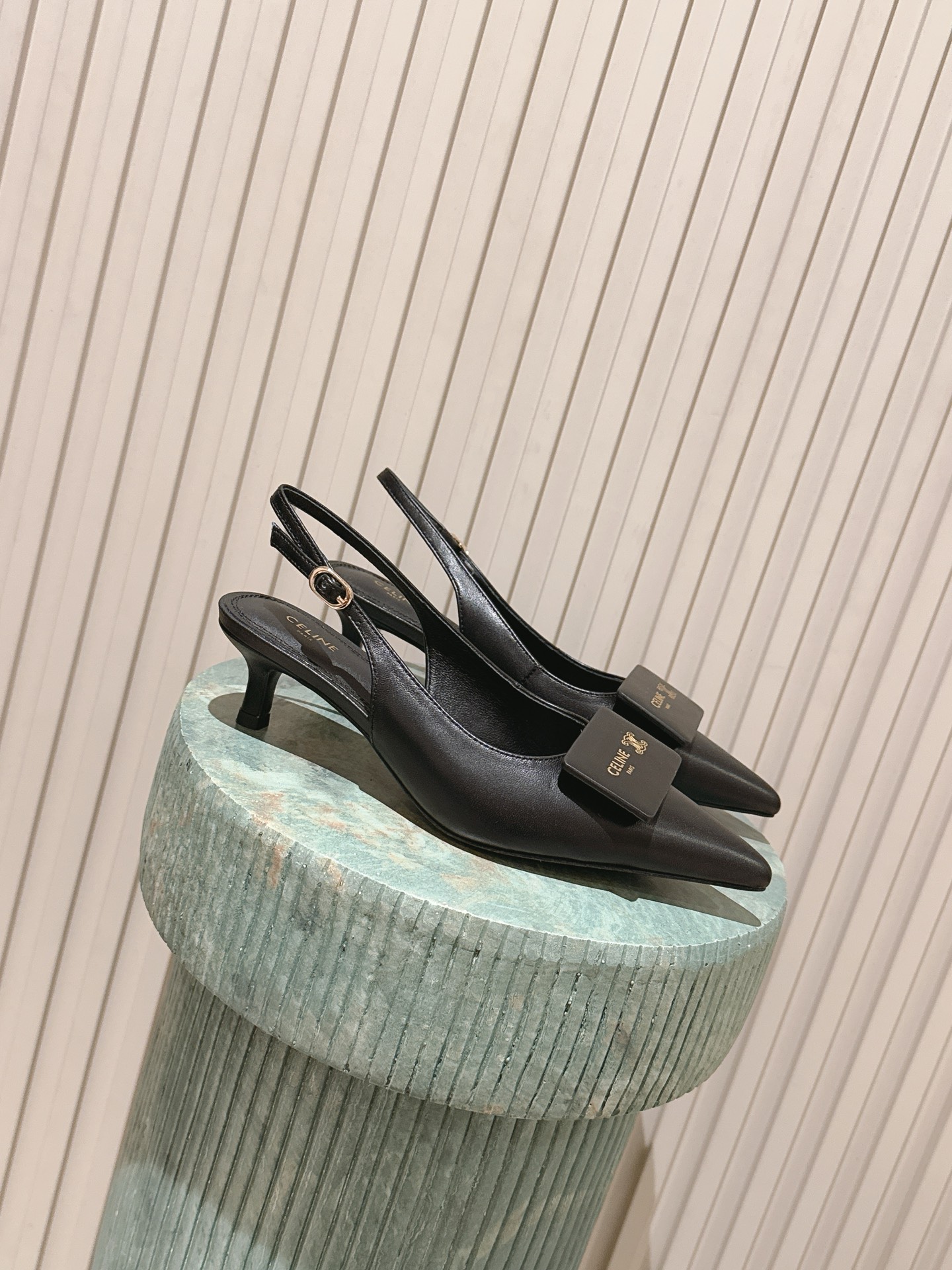 Celi New Pointed back strap with small high heels