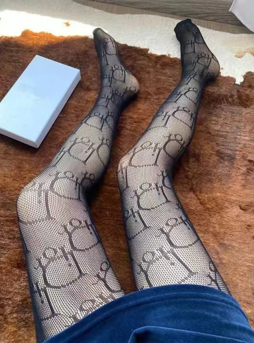 CD fishnet stockings with big D letter