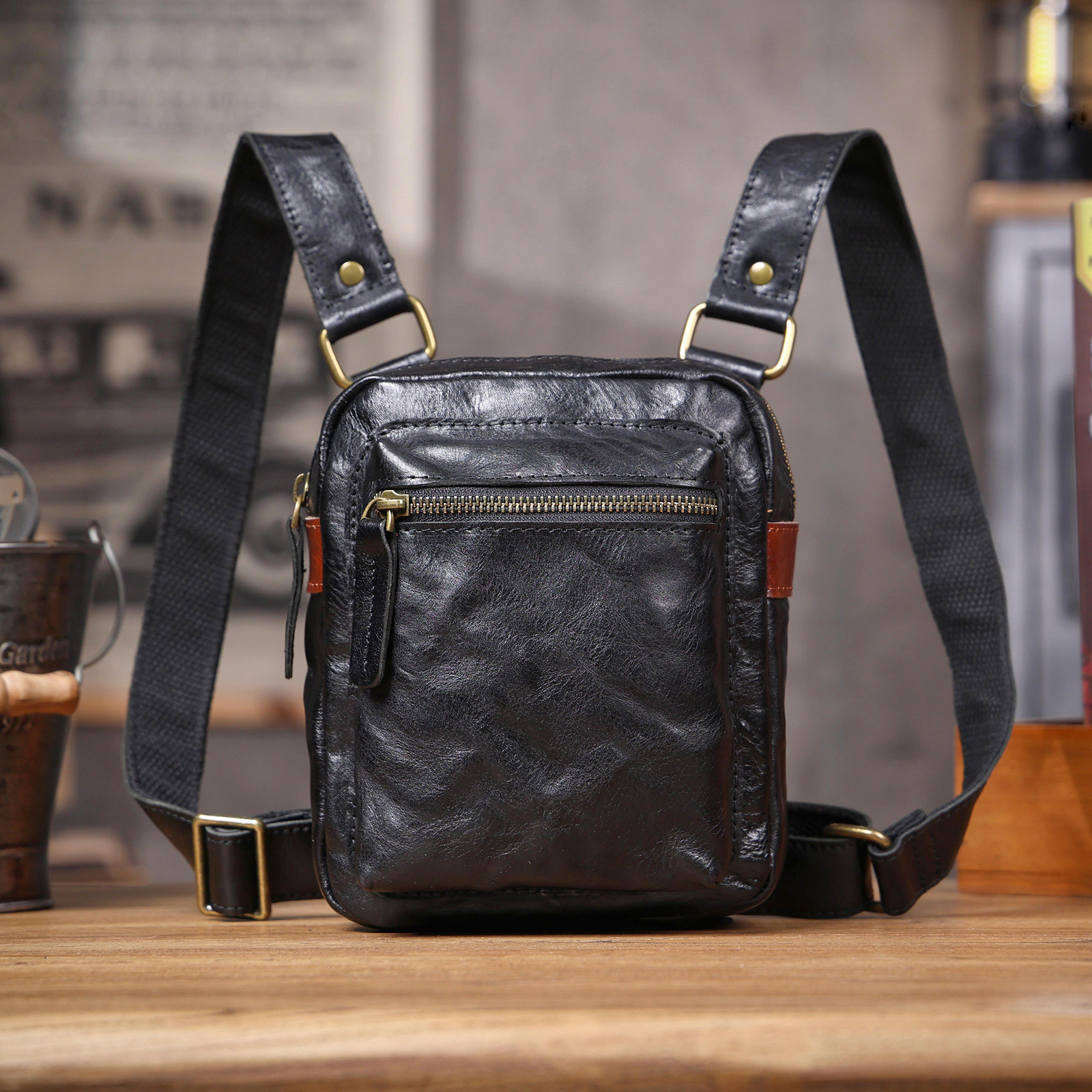 Sleek Black Leather Convertible Sling Bag - Compact Utility for Daily Carry