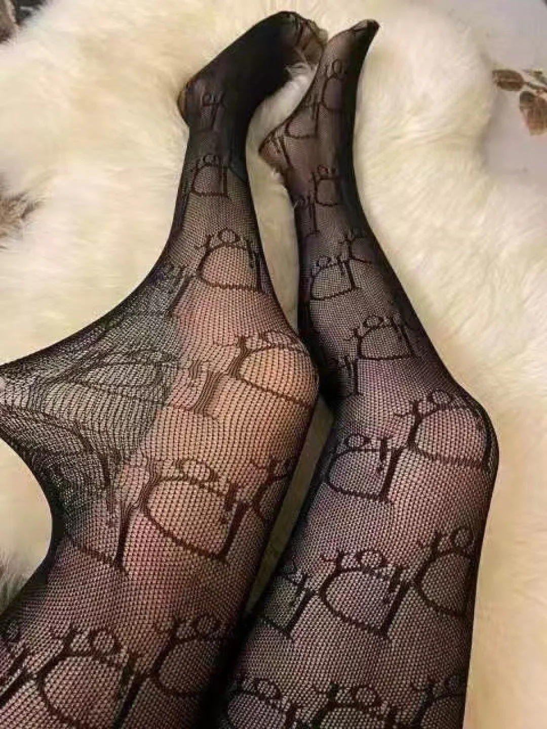 CD fishnet stockings with big D letter