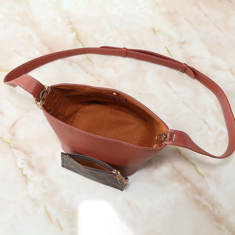 LV Designer Using Grain Leather To Shape A Compact Bucket Bag Configuration Luxury Bag Shoulder Bag Ladies Fashion Bag High Quality Leather Zipper Armpit Bag Lv Padlock Is Detachable