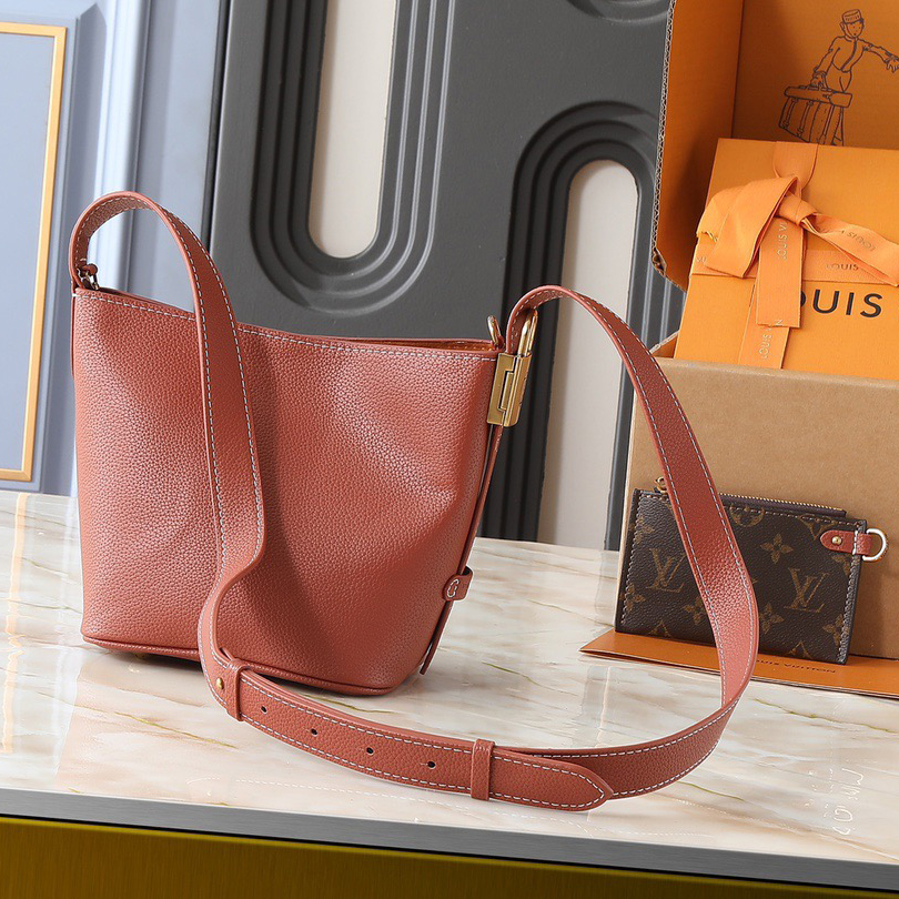 LV Designer Using Grain Leather To Shape A Compact Bucket Bag Configuration Luxury Bag Shoulder Bag Ladies Fashion Bag High Quality Leather Zipper Armpit Bag Lv Padlock Is Detachable