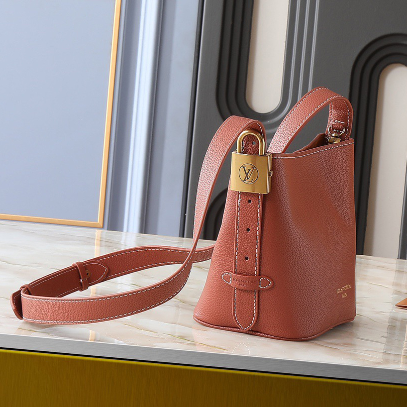 LV Designer Using Grain Leather To Shape A Compact Bucket Bag Configuration Luxury Bag Shoulder Bag Ladies Fashion Bag High Quality Leather Zipper Armpit Bag Lv Padlock Is Detachable