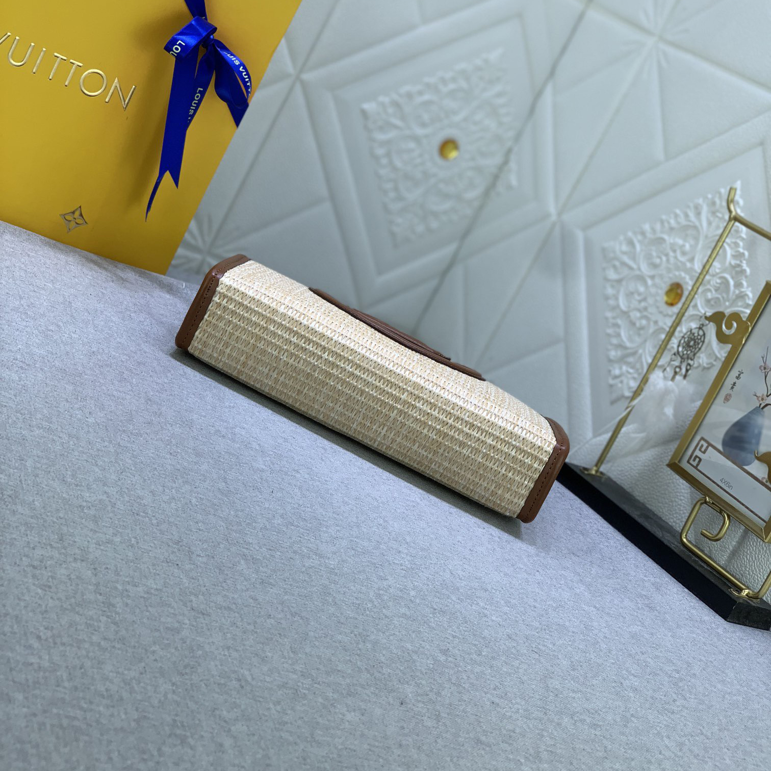 The LV High Quality Women Shoulder Bags Luxury Caramel Chain Toiletry Bag is made of natural Lafite Grass and features black leather and the Circle logo on the side Ladies Clutch Bag Shoulder Tote Female Purse Wallet Hand Bag