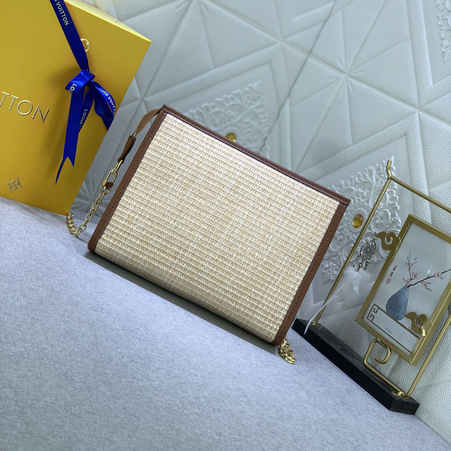 The LV High Quality Women Shoulder Bags Luxury Caramel Chain Toiletry Bag is made of natural Lafite Grass and features black leather and the Circle logo on the side Ladies Clutch Bag Shoulder Tote Female Purse Wallet Hand Bag