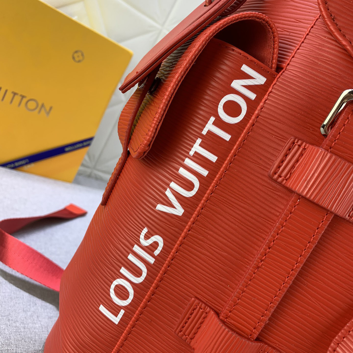 LV High Quality Unisex Backpack Luxuries Backpack Is Made Of Bright Colored Epi Xl Grain Leather Showcasing A Magnified Version Of Traditional Epi Embossing Upgrading Material Toughness And Wear Resistance LV Logo Female Backpack On The Side Bag