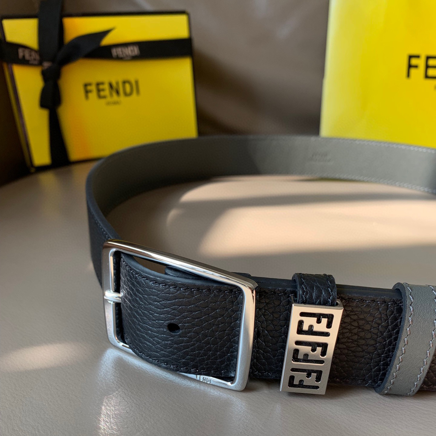 FENDI Men's Casual Needle Buckle Width 3.5cm Belt Comes with Two Belt Rings, One Adorned with Metal Nameplate and Engraved with FF Pattern Two tone Design Black Cuoio Romano Leather Material Gray Calf Inner Lining