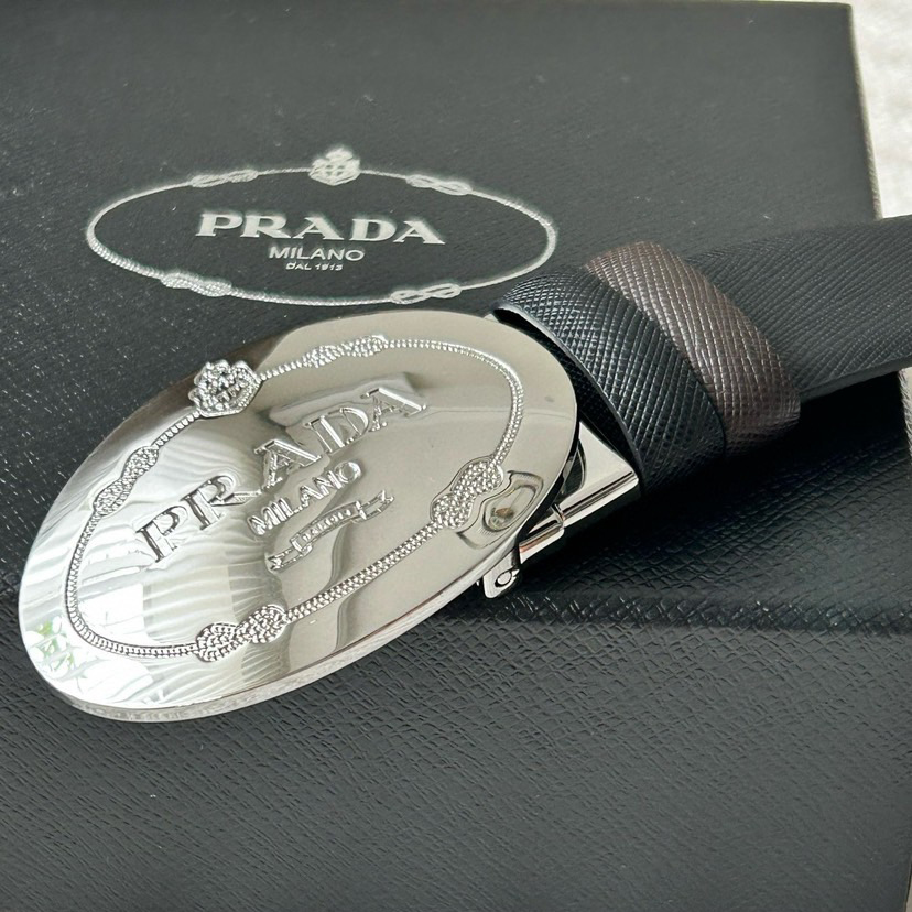 Prada Men's Business And Leisure Double Sided Belt Width 3.4cm Made Of Double Sided Saffiano Black With Coffee Head Leather Prada Logo Engraved In Elliptical Polished Steel Metal Buckle Contrasting Color Belt Loop Exquisite And Elegant