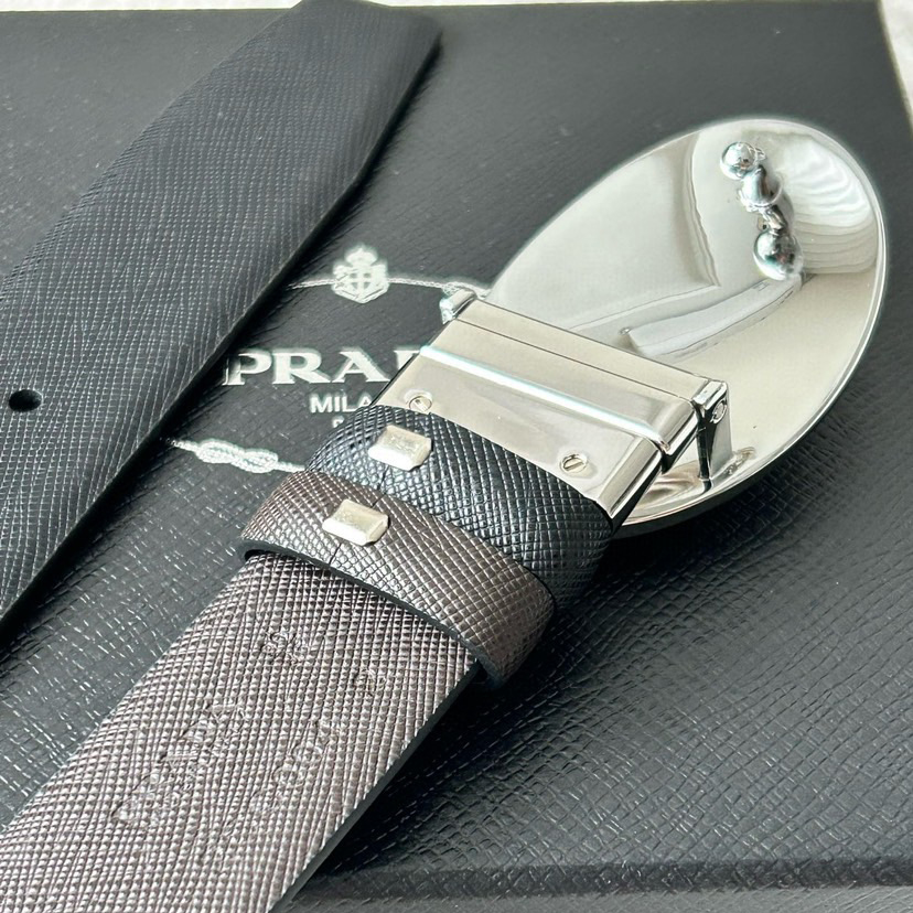 Prada Men's Business And Leisure Double Sided Belt Width 3.4cm Made Of Double Sided Saffiano Black With Coffee Head Leather Prada Logo Engraved In Elliptical Polished Steel Metal Buckle Contrasting Color Belt Loop Exquisite And Elegant