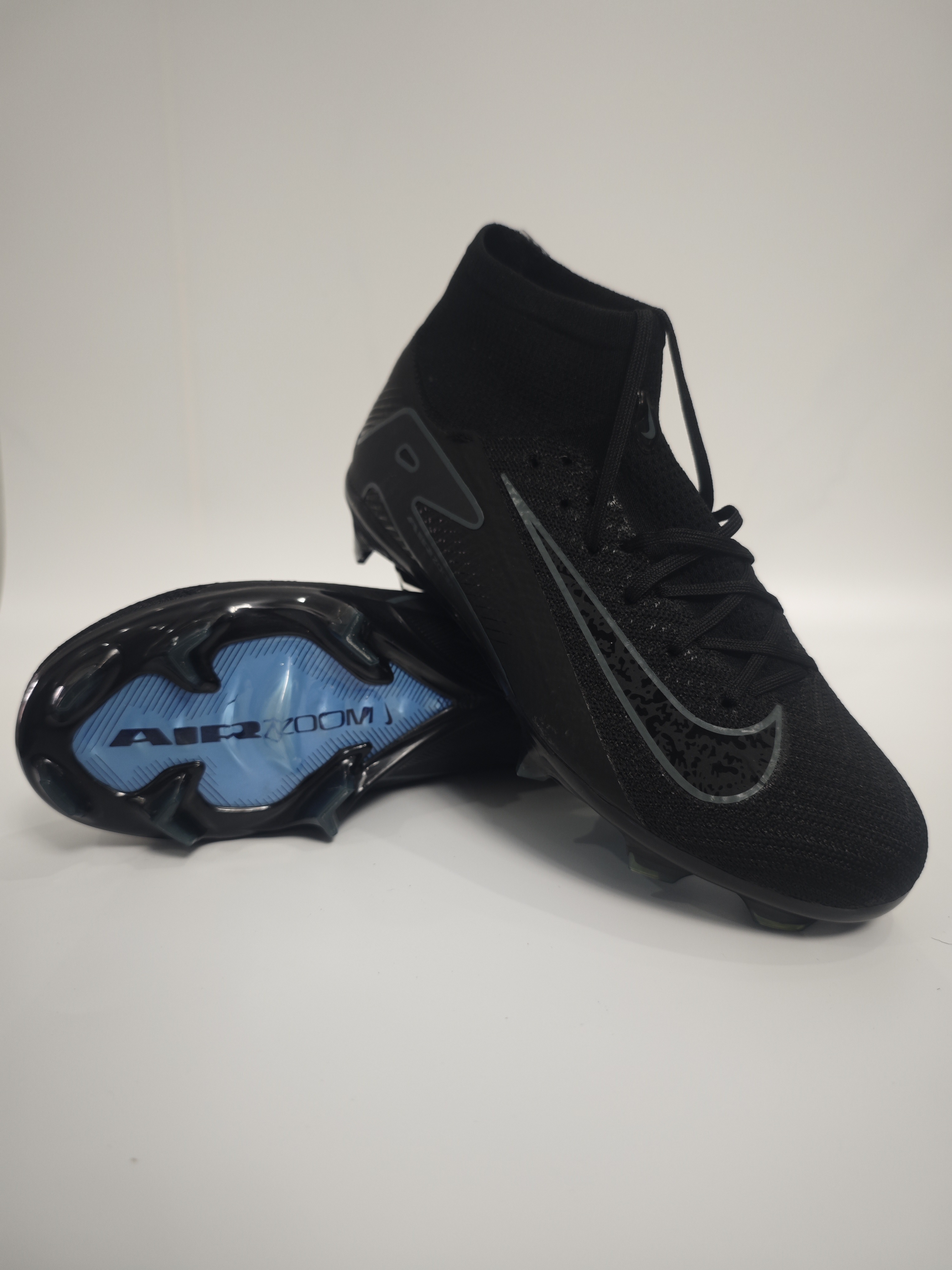 Nike Mercurial 16 FG Soccer Cleats with Built-in Bonded Pack: Full Air Cushion for All-Match Comfort, Waterproof Knit for Wet Pitches