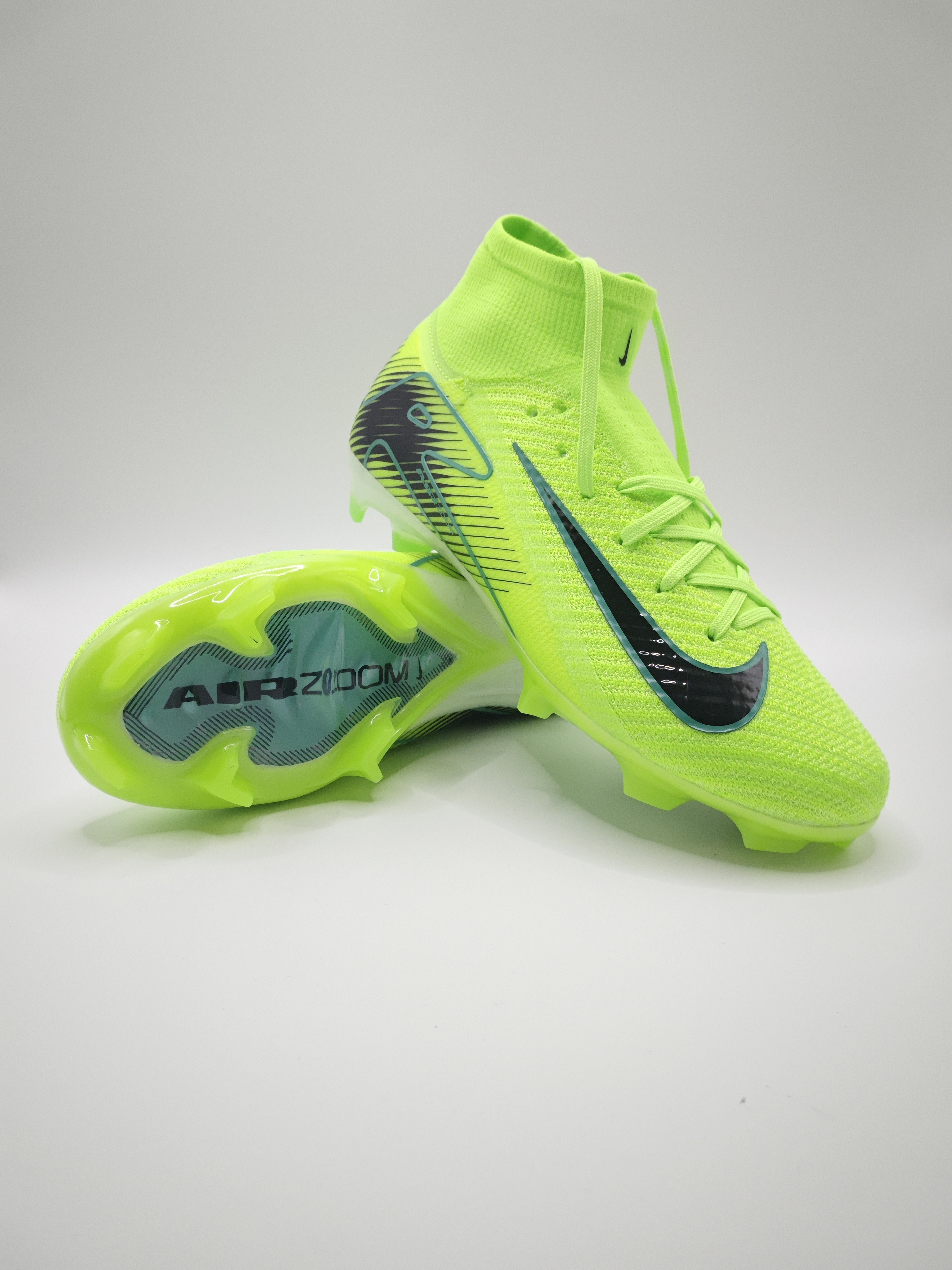 Nike Mercurial 16 FG Soccer Cleats with Built-in Bonded Pack: Full Air Cushion for All-Game Comfort, Waterproof Knit for Rainy Fields