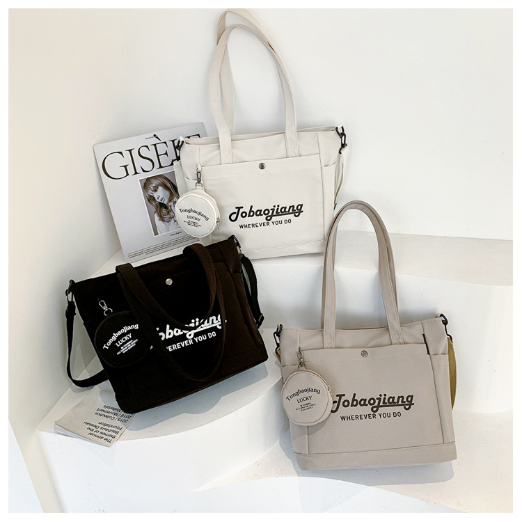 New Handheld Shoulder Bag for Women Fashion Versatile Canvas Bag Korean Version Pendant Crossbody Bag Letter Print Tote Bag